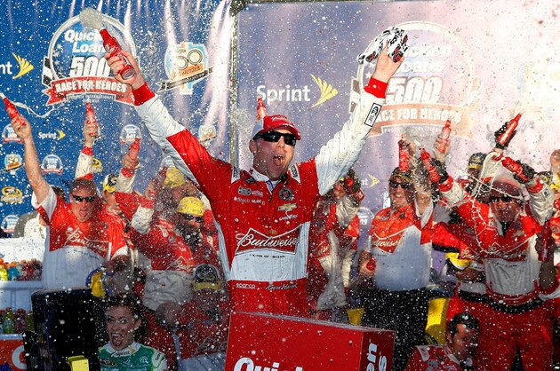 AVONDALE, AZ - NOVEMBER 09:  Kevin Harvick, driver of the #4 Budweiser Chevrolet, celebrates in victory lane after winning the NASCAR Sprint Cup Series Quicken Loans Race for Heroes 500 at Phoenix International Raceway on November 9, 2014 in Avondale, Arizona.  (Photo by Tom Pennington/Getty Images)