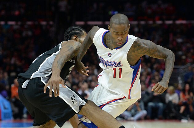 Nov 10, 2014; Los Angeles, CA, USA; Los Angeles Clippers guard Jamal Crawford (11) and San Antonio Spurs forward Kawhi Leonard (2) go for a loose ball in the second half of the game at Staples Center. Spurs won 89-85. Mandatory Credit: Jayne Kamin-Oncea-USA TODAY Sports