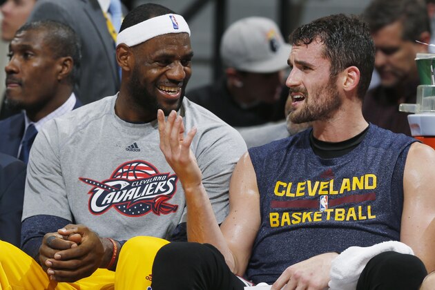 Cleveland Cavaliers forwards LeBron James, left, and Kevin Love joke with each other on the bench in the fourth quarter of the Cavaliers' 110-101 victory over the Denver Nuggets in an NBA basketball game in Denver on Friday, Nov. 7, 2014. (AP Photo/David Zalubowski)