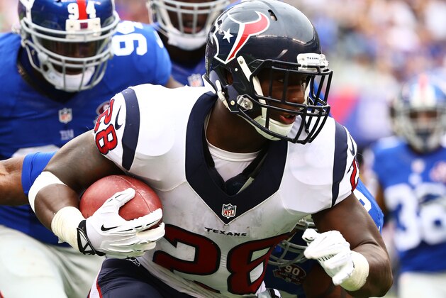 EAST RUTHERFORD, NJ - SEPTEMBER 21:  Alfred Blue #28 of the Houston Texans carries the ball against the New York Giants at MetLife Stadium on September 21, 2014 in East Rutherford, New Jersey.  (Photo by Al Bello/Getty Images)