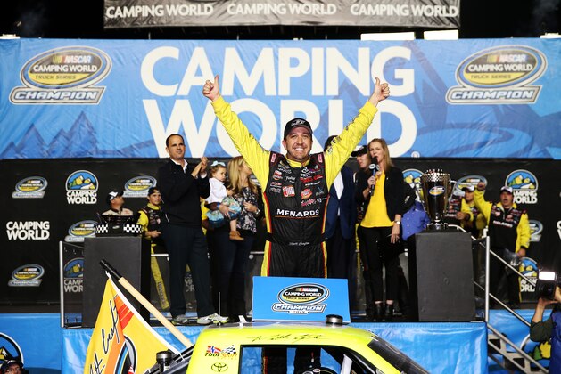 HOMESTEAD, FL - NOVEMBER 14:  Matt Crafton, driver of the #88 Jeld-Wen/Menards Toyota, celebrates in Victory Lane after winning the series championship and placing ninth in the NASCAR Camping World Truck Series Ford EcoBoost 200 at Homestead-Miami Speedway on November 14, 2014 in Homestead, Florida.  (Photo by Chris Graythen/Getty Images)
