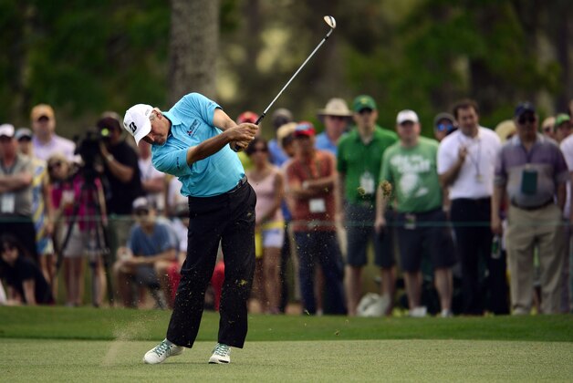 Apr 13, 2014; Augusta, GA, USA;  Fred Couples hits from the fairway of the 1st hole during the final round of the 2014 The Masters golf tournament at Augusta National Golf Club. Mandatory Credit: Michael Madrid-USA TODAY Sports