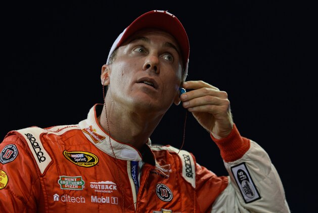 HOMESTEAD, FL - NOVEMBER 14:  Kevin Harvick, driver of the #4 Budweiser Chevrolet, stands on the grid during qualifying for the NASCAR Sprint Cup Series Ford EcoBoost 400 at Homestead-Miami Speedway on November 14, 2014 in Homestead, Florida.  (Photo by Robert Laberge/Getty Images)