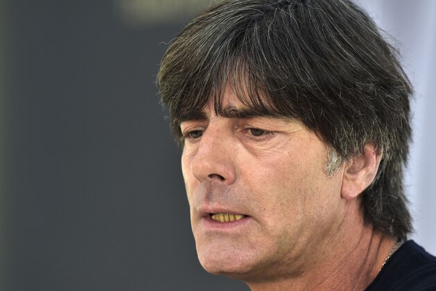 Germany's head coach Joachim Loew talks listens to the media at a press conference in Essen, Germany, Monday, Oct. 13, 2014. Germany will play a Euro 2016 group D qualifying soccer match against Ireland on Tuesday in Gelsenkirchen. (AP Photo/Martin Meissner)