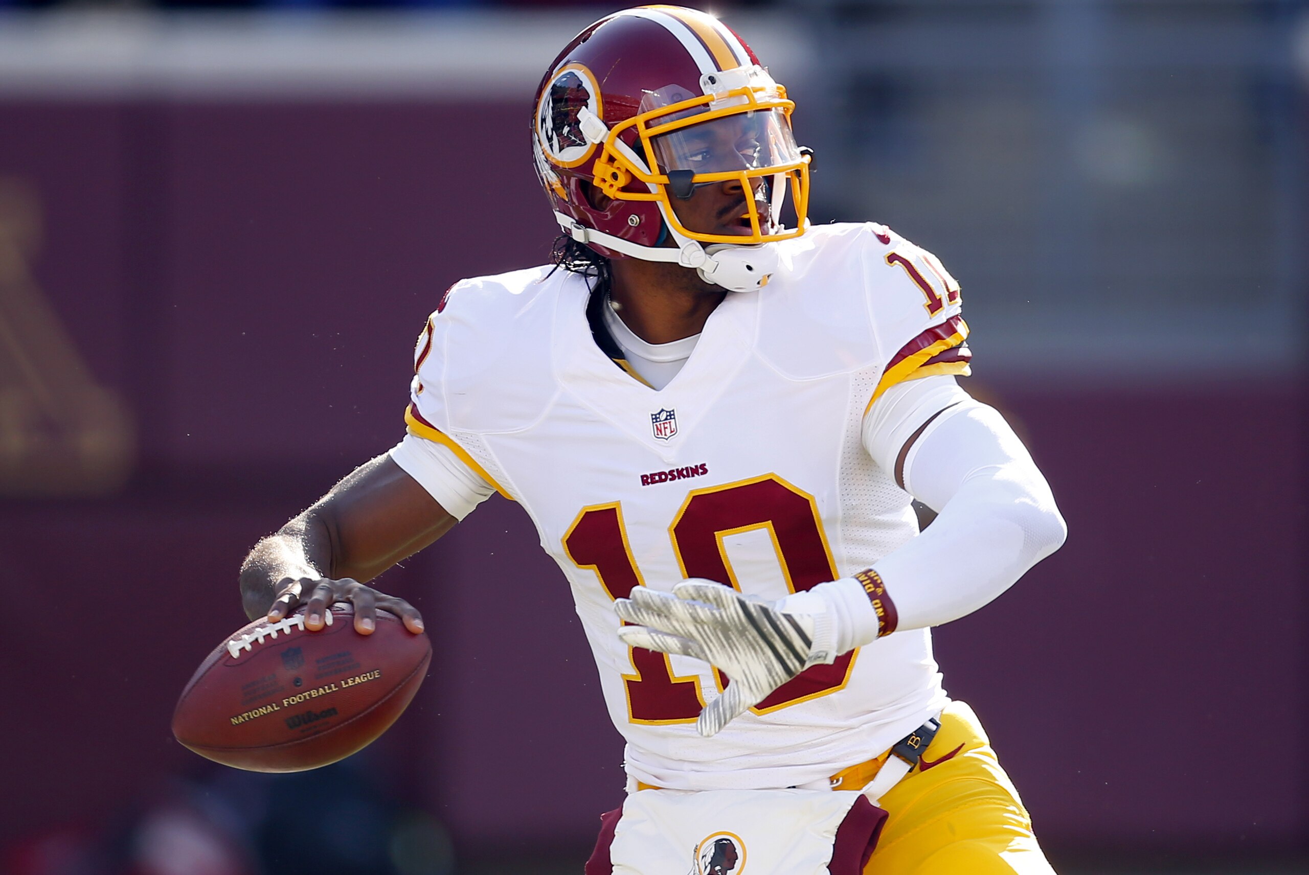 Washington Redskins quarterback Robert Griffin III (10) throws the ball against the Minnesota Vikings during an NFL football game, Sunday, Nov. 2, 2014, in Minneapolis. (Jeff Haynes/AP Images for Panini)