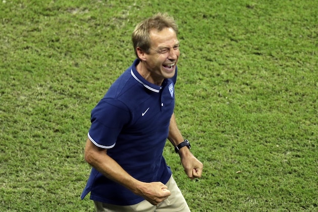 United States' head coach Juergen Klinsmann laughs after Clint Dempsey scored his side's 2nd goal during the group G World Cup soccer match between the USA and Portugal at the Arena da Amazonia in Manaus, Brazil, Sunday, June 22, 2014. (AP Photo/Themba Hadebe)