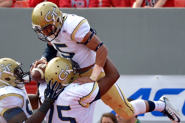 RALEIGH, NC - NOVEMBER 08:  Justin Thomas #5 celebrates with teammates after scoring a touchdown against the North Carolina State Wolfpack during their game at Carter-Finley Stadium on November 8, 2014 in Raleigh, North Carolina.  (Photo by Grant Halverson/Getty Images)