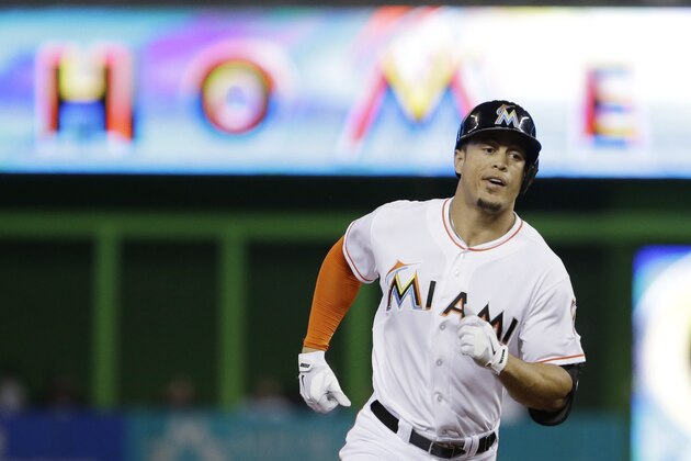 Miami Marlins' Giancarlo Stanton rounds second base after hitting a home run during the first inning of a baseball game against the New York Mets, Monday, Sept. 1, 2014 in Miami. (AP Photo/Wilfredo Lee)