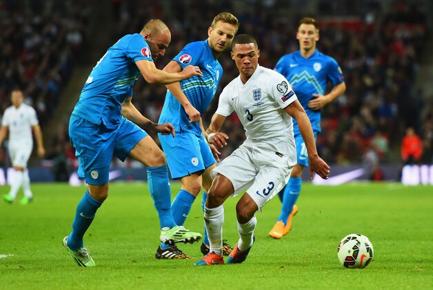 LONDON, ENGLAND - NOVEMBER 15: Miso Brecko of Slovenia (L) vies with Kieran Gibbs of England during the EURO 2016 Qualifier Group E match between England and Slovenia at Wembley Stadium on November 15, 2014 in London, England.  (Photo by Shaun Botterill/Getty Images)