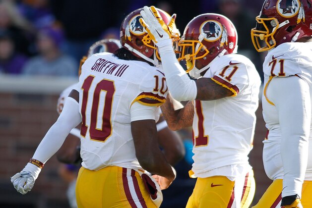 Nov 2, 2014; Minneapolis, MN, USA; Washington Redskins quarterback Robert Griffin III (10) and wide receiver DeSean Jackson (11) celebrate their touchdown pass and catch against the Minnesota Vikings in the third quarter at TCF Bank Stadium. The Vikings win 29-26. Mandatory Credit: Bruce Kluckhohn-USA TODAY Sports
