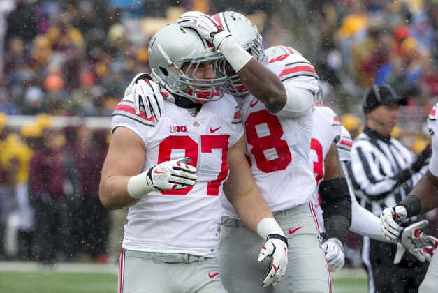 Nov 15, 2014; Minneapolis, MN, USA; Ohio State Buckeyes defensive lineman Joey Bosa (97) gets congratulated by defensive lineman Steve Miller (88) after sacking Minnesota Golden Gophers quarterback Mitch Leidner (not pictured) in the first half at TCF Bank Stadium. Mandatory Credit: Jesse Johnson-USA TODAY Sports