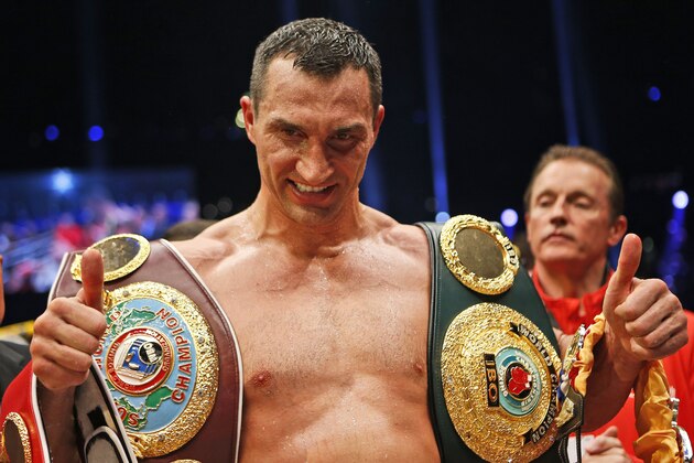 IBF, WBA, WBO and IBO champion Wladimir Klitschko from Ukraine, celebrates after winning the IBF heavyweight world championships title bout against Bulgarian boxer Kubrat Pulev in Hamburg, Germany, Saturday, Nov. 15,  2014.(AP Photo/Frank Augstein)