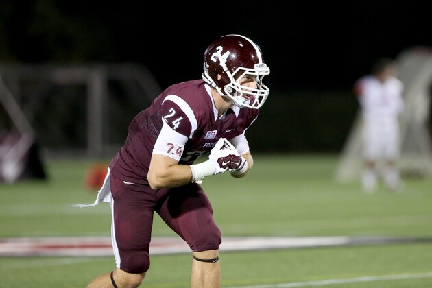 Fordham Rams Brian Wetzel #24 in action against the St, Francis (PA) Red Flash during a college football game on Saturday, August 30, 2014 in the Bronx, NY.  (AP Photo/Gregory Payan)