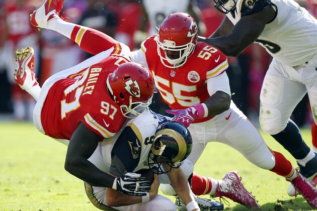 St. Louis Rams quarterback Austin Davis (9) is sacked by Kansas City Chiefs defensive end Allen Bailey (97) and linebacker Dee Ford (55) in the second half of an NFL football game in Kansas City, Mo., Sunday, Oct. 26, 2014. (AP Photo/Ed Zurga)