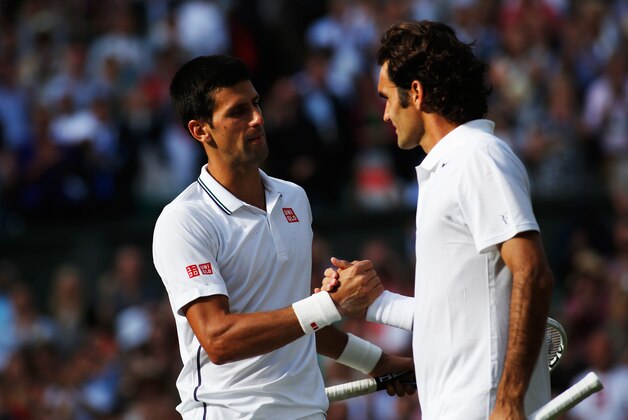 LONDON, ENGLAND - JULY 06:  Novak Djokovic of Serbia shakes hands with Roger Federer of Switzerland after their Gentlemen's Singles Final match on day thirteen of the Wimbledon Lawn Tennis Championships at the All England Lawn Tennis and Croquet Club on July 6, 2014 in London, England.  (Photo by Pool/Getty Images)