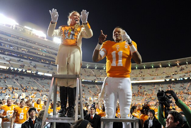 Nov 15, 2014; Knoxville, TN, USA; Tennessee Volunteers quarterback Joshua Dobbs (11) leads the band after the game against the Kentucky Wildcats at Neyland Stadium. Tennessee won 50 to 16. Mandatory Credit: Randy Sartin-USA TODAY Sports