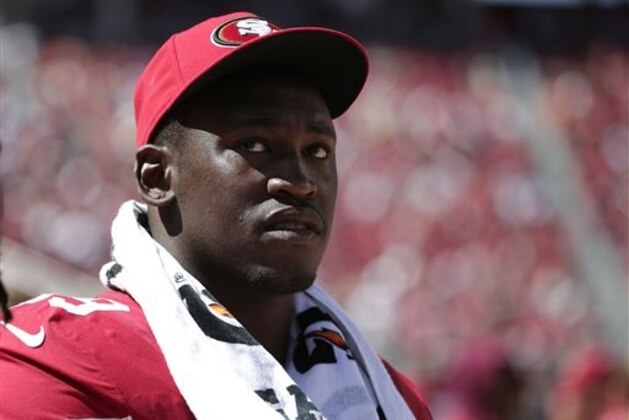 FILE - In this Aug. 17, 2014, file photo, San Francisco 49ers linebacker Aldon Smith (99) watches from the sideline during the second half of an NFL preseason football game against the Denver Broncos in Santa Clara, Calif. Aldon Smith has been suspended for nine games by the NFL after a series of off-field legal issues. A statement Friday, Aug. 29, 2014, from the league said Smith had violated the NFL’s substance abuse and personal conduct policies. (AP Photo/Marcio Jose Sanchez, File)