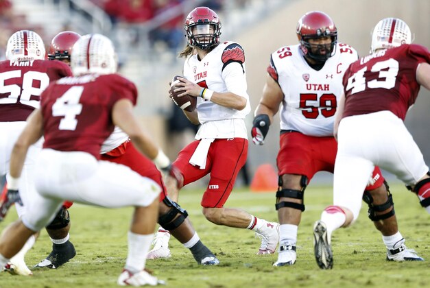 Nov 15, 2014; Stanford, CA, USA; Utah Utes quarterback Travis Wilson (7) looks down field for a receiver during the second quarter against the Stanford Cardinal at Stanford Stadium. Mandatory Credit: Bob Stanton-USA TODAY Sports