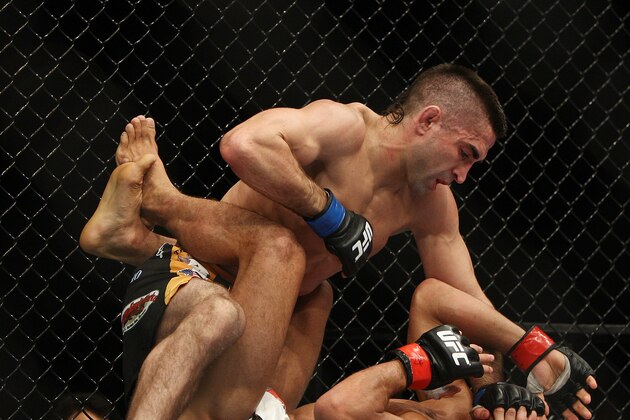 Jose Aldo, right, of Brazil and Ricardo Lamas of Chicago, IL fight in the fifth round of the Ultimate Fighting Featherweight Championship Mix Martial Arts bout in Newark, N.J. on Saturday, Feb. 1, 2014. Aldo won by unanimous decision in five rounds. (AP Photo/Tim Larsen)