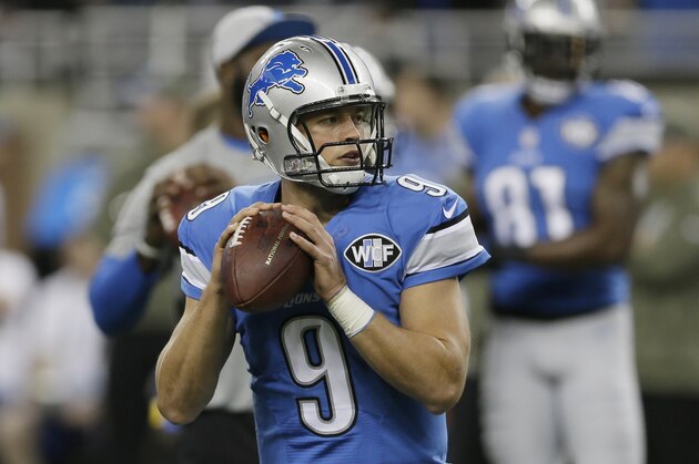 Detroit Lions quarterback Matthew Stafford looks downfield during warmups before an NFL football game against the Miami Dolphins in Detroit, Sunday, Nov. 9, 2014. (AP Photo/Carlos Osorio)