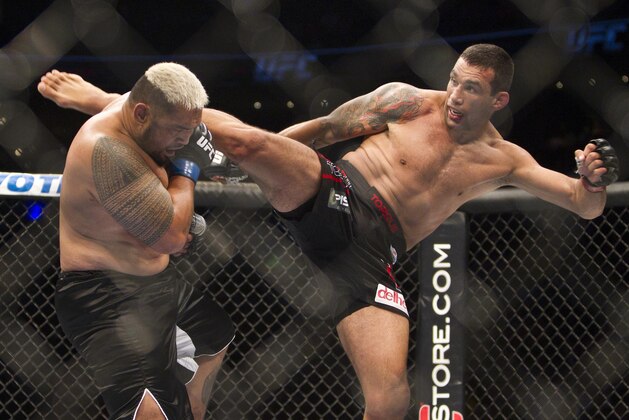 New Zealand's Mark Hunt, left,  battles against Brazil's Fabricio Werdum from during a UFC 180 interim Heavyweight title fight in Mexico City, Saturday, Nov. 15, 2014. Werdum won the fight by KO/TKO. (AP Photo/Christian Palma)