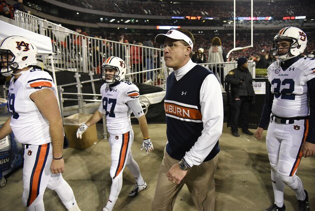 Nov 15, 2014; Athens, GA, USA; Auburn Tigers head coach Gus Malzahn walks off the field with his players prior to the game against the Georgia Bulldogs at Sanford Stadium. Georgia defeated Auburn 34-7. Mandatory Credit: Dale Zanine-USA TODAY Sports