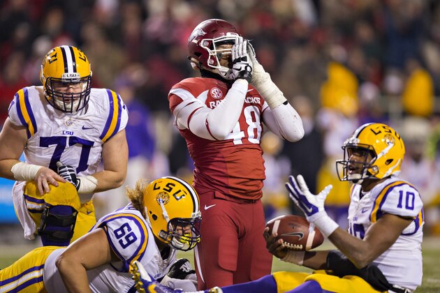 FAYETTEVILLE, AR - NOVEMBER 15:  Deatrich Wise Jr. #48 of the Arkansas Razorbacks celebrates after sacking Anthony Jennings #10 of the LSU Tigers in the second quarter of a game at Razorback Stadium on November 15, 2014 in Fayetteville, Arkansas.  The Razorbacks defeated the Tigers 17-0.  (Photo by Wesley Hitt/Getty Images)