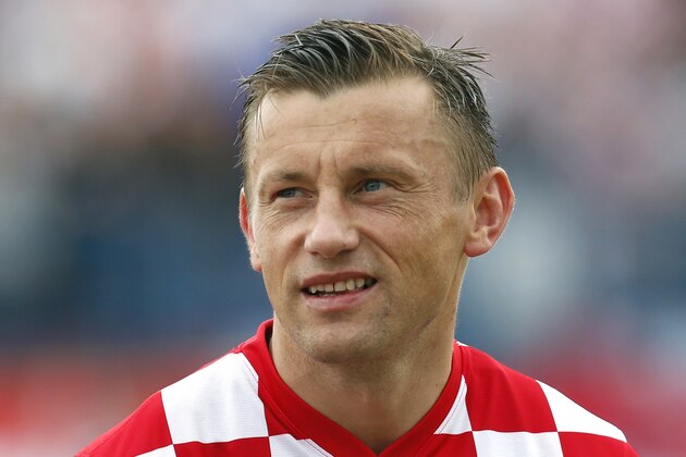 Croatia's Ivica Olic listens to the national anthem ahead of the international soccer friendly match between Croatia and Mali, in Osijek, Croatia, Saturday, May 31, 2014. (AP Photo/Darko Bandic)