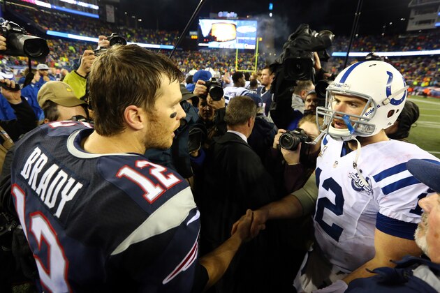 FOXBORO, MA - JANUARY 11:  (L-R) Tom Brady #12 of the New England Patriots shakes hands with Andrew Luck #12 of the Indianapolis Colts after their AFC Divisional Playoff game at Gillette Stadium on January 11, 2014 in Foxboro, Massachusetts. The New England Patriots defeated the Indianapolis Colts 43 to 22.  (Photo by Al Bello/Getty Images)
