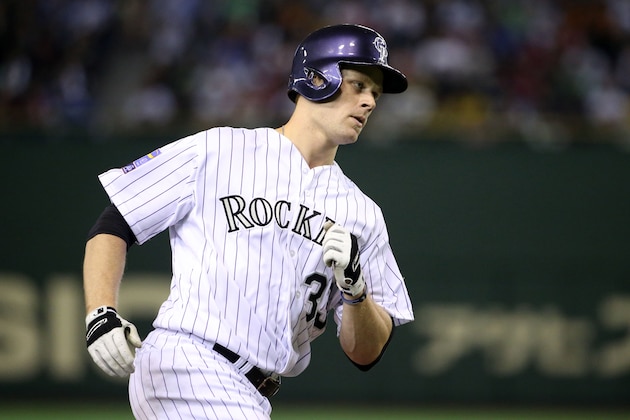 TOKYO, JAPAN - NOVEMBER 16:  Justin Morneau #33 of the Colorado Rockies heads home after hitting a three-run homer  in the third inning during the game four of Samurai Japan and MLB All Stars at Tokyo Dome on November 16, 2014 in Tokyo, Japan.  (Photo by Atsushi Tomura/Getty Images)
