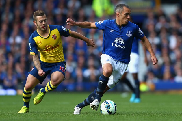 LIVERPOOL, ENGLAND - AUGUST 23:  Jack Wilshere of Arsenal  in action with Leon Osman of Everton during the Barclays Premier League match between Everton and Arsenal at Goodison Park on August 23, 2014 in Liverpool, England.  (Photo by Clive Brunskill/Getty Images)