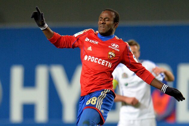 KHIMKI, RUSSIA - MARCH 31: Seydou Doumbia (Top) of PFC CSKA Moscow is challenged by Adrian Ropotan of FC Volga Nizhny Novgorod during the Russian Premier League match between PFC CSKA Moscow and FC Volga Nizhny Novgorod at the Arena Khimki Stadium on March 31, 2014 in Khimki, Russia.  (Photo by Epsilon/Getty Images)
