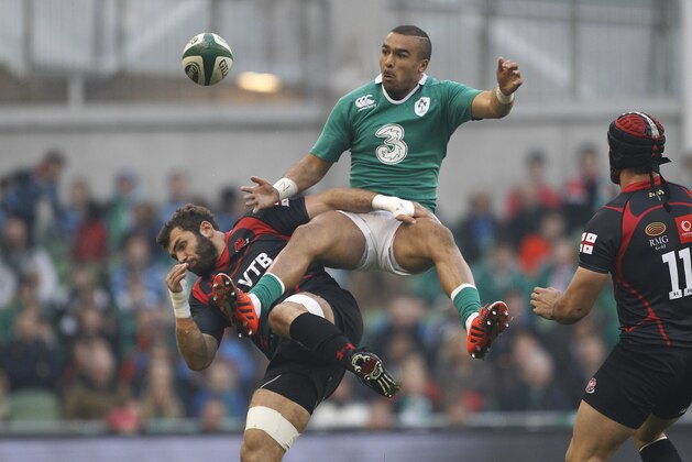 Ireland's Simon Zebo, right, is tackled by Georgia's Dimitri Basilaia during their international rugby union match at the Aviva stadium, Dublin, Ireland, Sunday, Nov. 16, 2014.  (AP Photo/Peter Morrison)