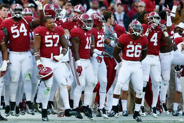 TUSCALOOSA, AL - NOVEMBER 15:  The Alabama Crimson Tide sideline celebrates after a touchdown by Derrick Henry #27 against the Mississippi State Bulldogs at Bryant-Denny Stadium on November 15, 2014 in Tuscaloosa, Alabama.  (Photo by Kevin C. Cox/Getty Images)