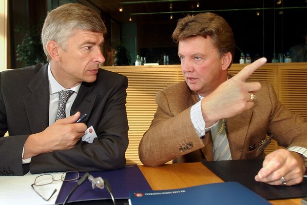 Europe's top soccer coaches Arsene Wenger, left, Arsenal FC, speaks with Louis Van Gaal, right, FC Barcelona, prior the UEFA  Elite Coaches forum  at the UEFA headquarters, in Nyon, Switzerland, Wednesday, Sept. 4, 2002. UEFA is staging  the fourth Elite Coaches Forum with the aim of allowing leading technicians in European soccer to exchange views and to make suggestions about the future of soccer in Europe. (AP Photo/Keystone/Laurent Gillieron)