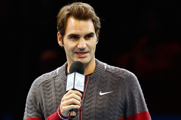 LONDON, ENGLAND - NOVEMBER 16:  Roger Federer of Switzerland announces his decision to withdraw from the singles final match against Novak Djokovic of Serbia on day eight of the Barclays ATP World Tour Finals at O2 Arena on November 16, 2014 in London, England.  (Photo by Julian Finney/Getty Images)