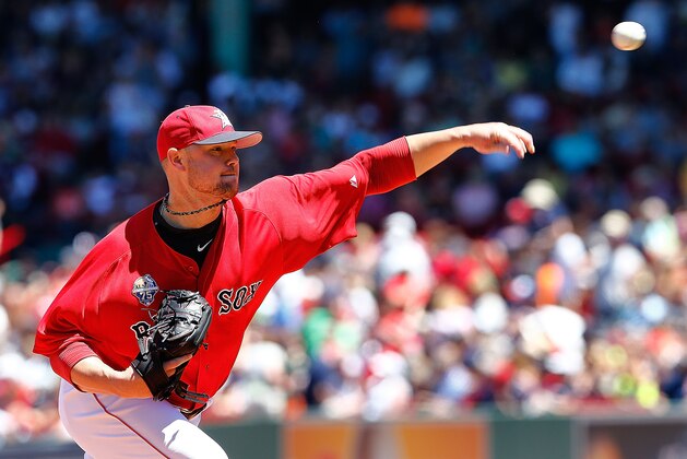 BOSTON, MA - JULY 5: Jon Lester #31 of the Boston Red Sox throws against the Baltimore Orioles in the first inning during the first game of a doubleheader at Fenway Park on July 5, 2014 in Boston, Massachusetts.  (Photo by Jim Rogash/Getty Images)
