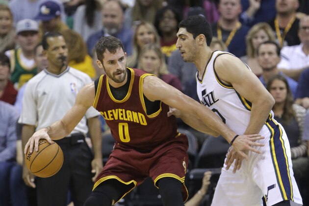 Utah Jazz's Enes Kanter (0) defends against Cleveland Cavaliers' Kevin Love (0) in the first quarter during an NBA basketball game Wednesday, Nov. 5, 2014, in Salt Lake City. (AP Photo/Rick Bowmer)