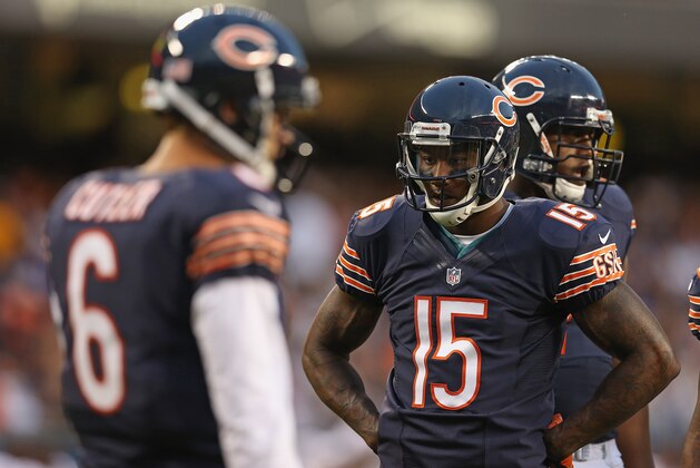 CHICAGO, IL - AUGUST 18:  Brandon Marshall #15 and Jay Cutler #6 of the Chicago Bears wait during a time out against the Washington Redskins during a preseason game at Soldier Field on August 18, 2012 in Chicago, Illinois. The Bears defeated the Redskins 33-31. (Photo by Jonathan Daniel/Getty Images)