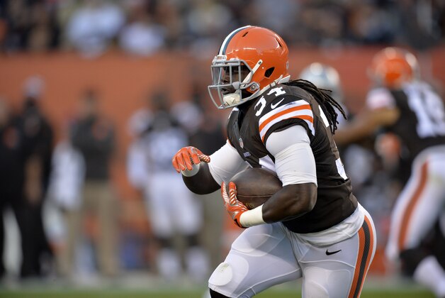 Cleveland Browns running back Isaiah Crowell runs the ball against the Oakland Raiders in the third quarter of an NFL football game Sunday, Oct. 26, 2014, in Cleveland. (AP Photo/David Richard)