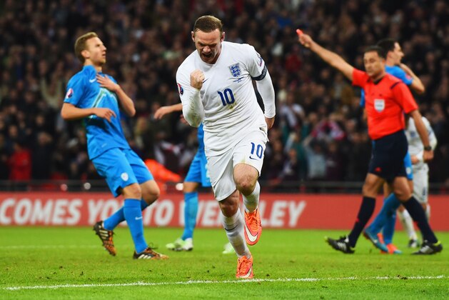 LONDON, ENGLAND - NOVEMBER 15:  Wayne Rooney of England celebrates scoring England's first and equalizing goal during the EURO 2016 Qualifier Group E match between England and Slovenia at Wembley Stadium on November 15, 2014 in London, England.  (Photo by Shaun Botterill/Getty Images)