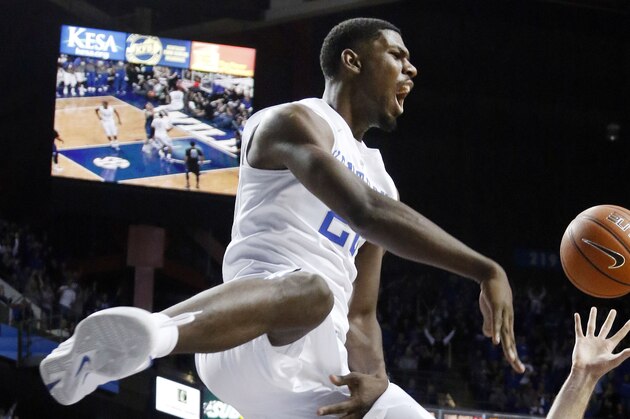 Kentucky's Alex Poythress celebrates after his dunk during the second half of an NCAA college basketball game against Buffalo, Sunday, Nov. 16, 2014, in Lexington, Ky. Kentucky won 71-52. (AP Photo/James Crisp)