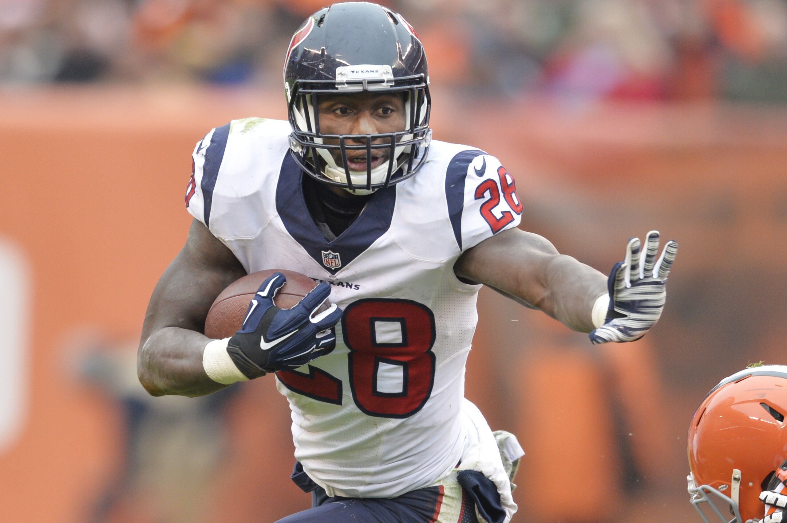Houston Texans running back Alfred Blue (28) runs the ball against the Cleveland Browns in the third quarter of an NFL football game Sunday, Nov. 16, 2014, in Cleveland. (AP Photo/David Richard)