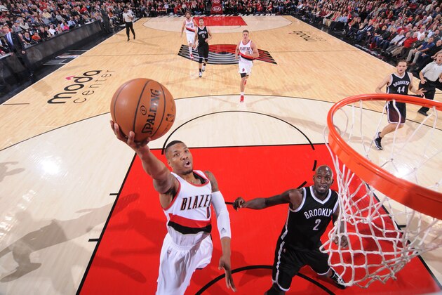 PORTLAND, OR - NOVEMBER 15: Damian Lillard #0 of the Portland Trail Blazers goes up for a shot against the Brooklyn Nets on November 15, 2014 at the Moda Center Arena in Portland, Oregon. NOTE TO USER: User expressly acknowledges and agrees that, by downloading and or using this photograph, user is consenting to the terms and conditions of the Getty Images License Agreement. Mandatory Copyright Notice: Copyright 2014 NBAE (Photo by Sam Forencich/NBAE via Getty Images)