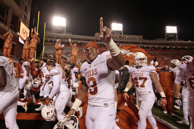STILLWATER, OK - NOVEMBER 15:   Linebacker Jordan Hicks #3 of the Texas Longhorns celebrates after the game against the Oklahoma State Cowboys November 15, 2014 at Boone Pickens Stadium in Stillwater, Oklahoma. The Longhorns defeated the Cowboys 28-7.  (Photo by Brett Deering/Getty Images)