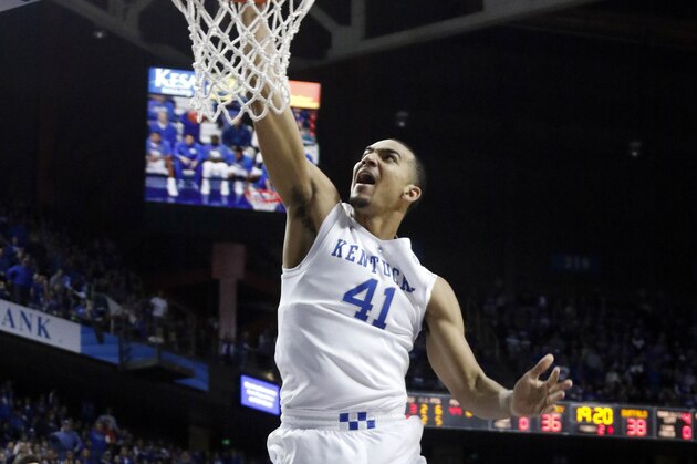 Kentucky's Trey Lyles (41) dunks near teammates Marcus Lee (00) and Devin Booker (1) during the second half of an NCAA college basketball game against Buffalo, Sunday, Nov. 16, 2014, in Lexington, Ky. Kentucky won 71-52. (AP Photo/James Crisp)