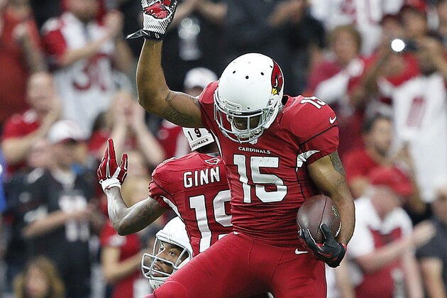 Arizona Cardinals wide receiver Michael Floyd (15) celebrates his touchdown with teammate Ted Ginn Jr. (19) during an NFL football game against the Detroit Lions, Sunday, Nov. 16, 2014, in Glendale, Ariz. (AP Photo/Ralph Freso)