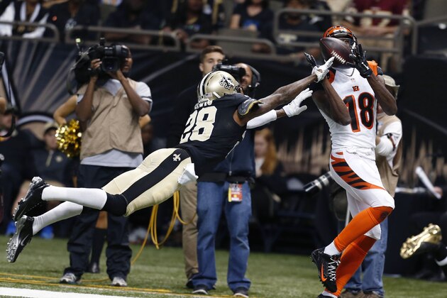 Cincinnati Bengals wide receiver A.J. Green (18) pulls in a touchdown reception as New Orleans Saints cornerback Keenan Lewis (28) defends in the second half of an NFL football game in New Orleans, Sunday, Nov. 16, 2014. THe Bengals won 27-10. (AP Photo/Rogelio Solis)
