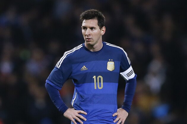 Argentina's Lionel Messi stands during the international friendly soccer match between Argentina and Croatia at the Boleyn Ground in London, Wednesday, Nov. 12, 2014. (AP Photo/Kirsty Wigglesworth)