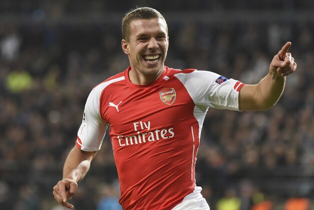 Arsenal's Lukas Podolski celebrates scoring 2-1 during the Group D Champions League match between Anderlecht and Arsenal at Constant Vanden Stock Stadium in Brussels, Belgium, Wednesday Oct. 22, 2014. (AP Photo/Geert Vanden Wijngaert)